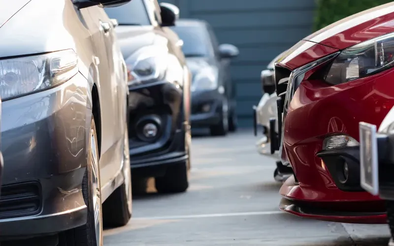 Cars in a parking lot.