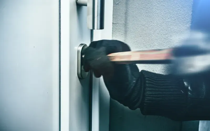 Person breaking into a home.