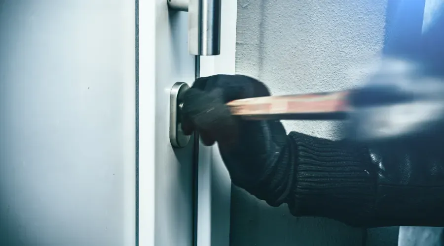 Person breaking into a home.