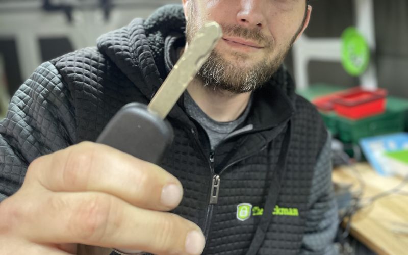 Lockman employee holding a key.