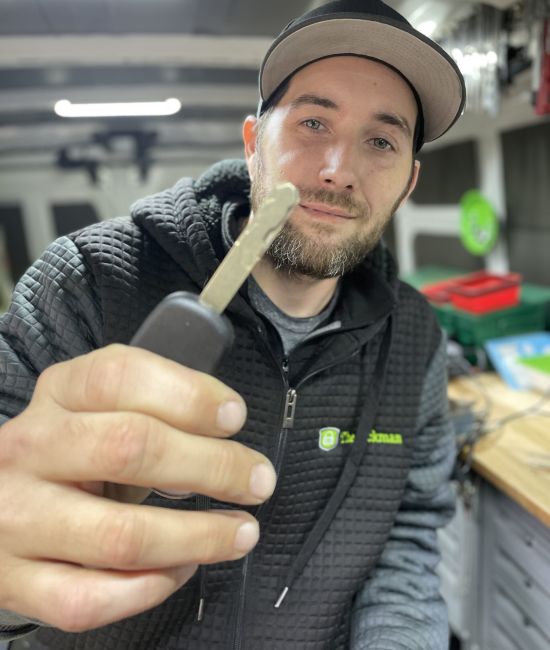 Lockman employee holding a key.