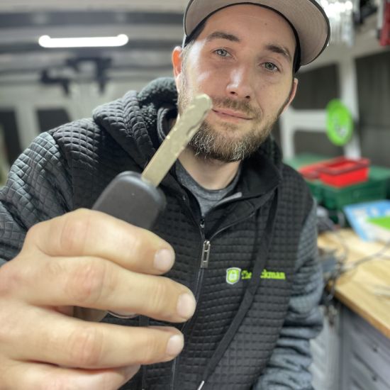 Lockman employee holding a key.